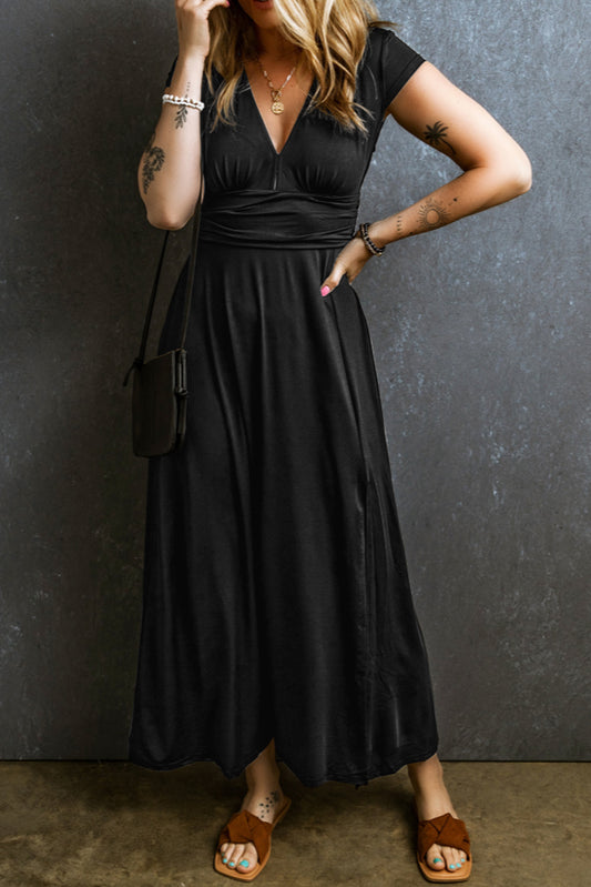 Woman wearing a black Maxi Dress with Short Sleeves, Shirred High Waist, V Neck. front view