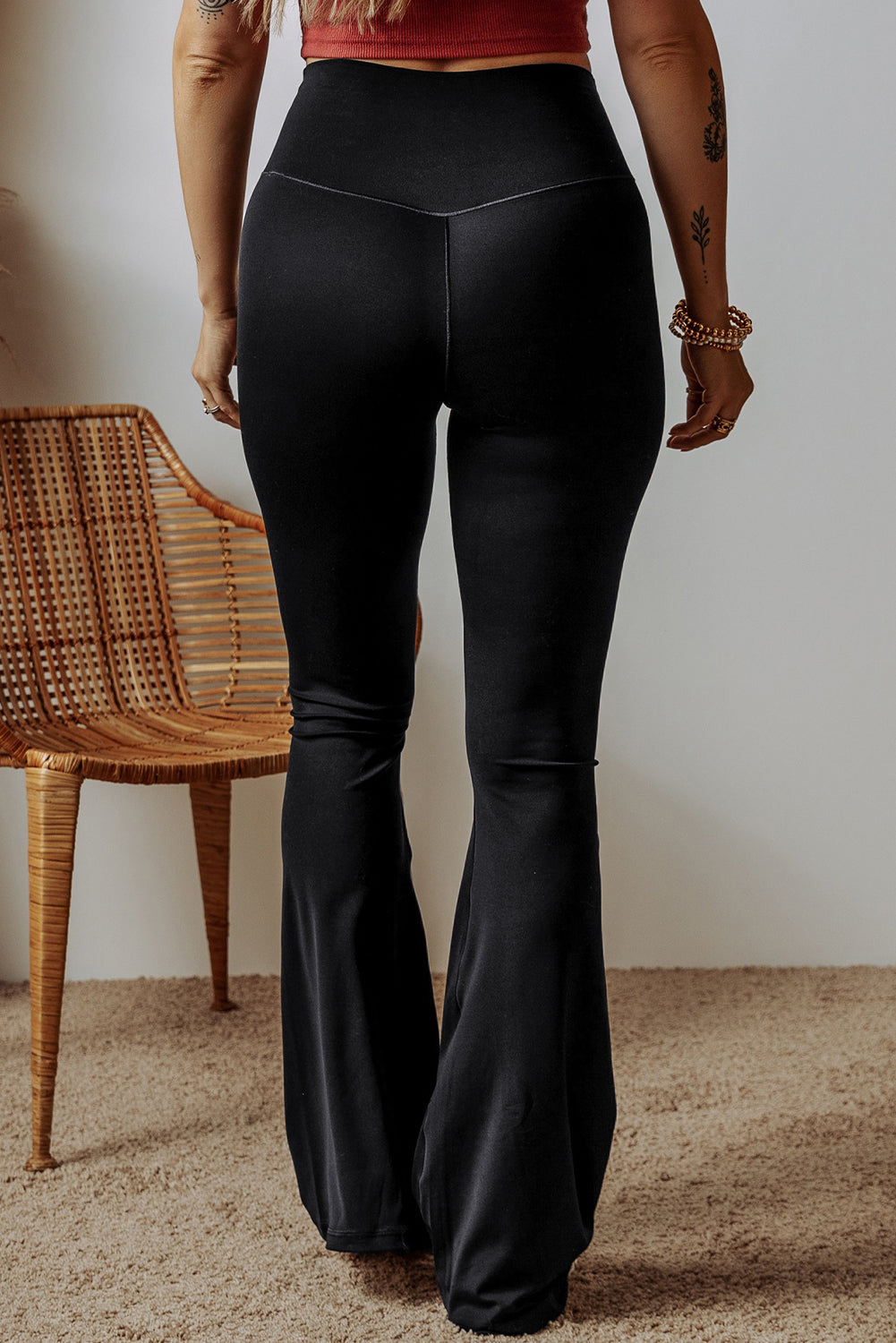 Black high waist, v-shape, flare leg leggings, back view