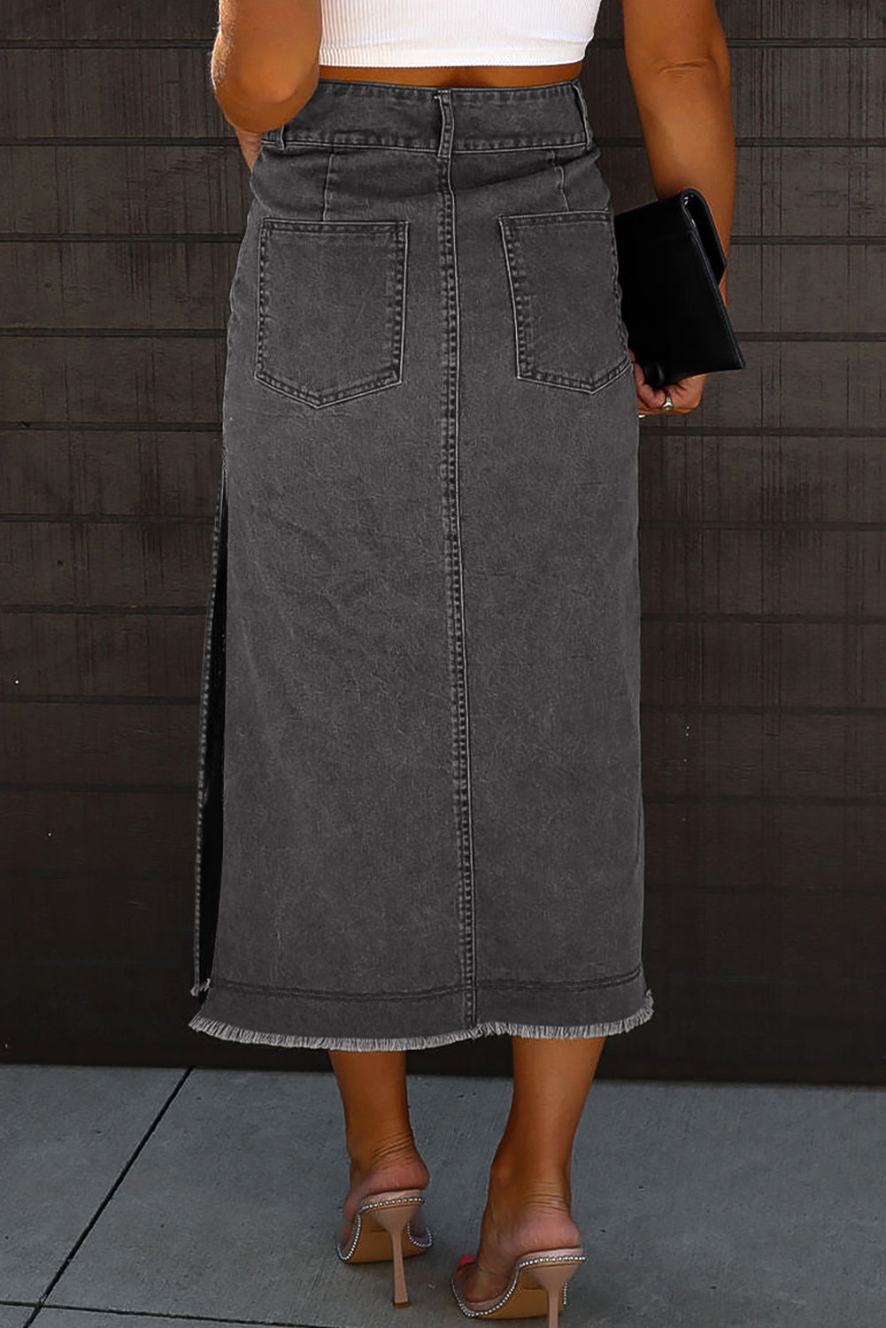 Black Midi Denim Skirt with Raw Edge, Side Slits, Button closure. Back view